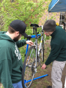 mechanics working on a bike